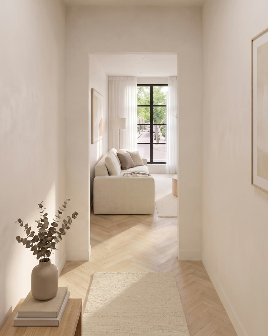 Hallway of the sample apartment, looking through the doorway into the living room